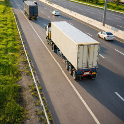 Top View White Truck Motion Blur Highway Road With Container Transportation 250x250